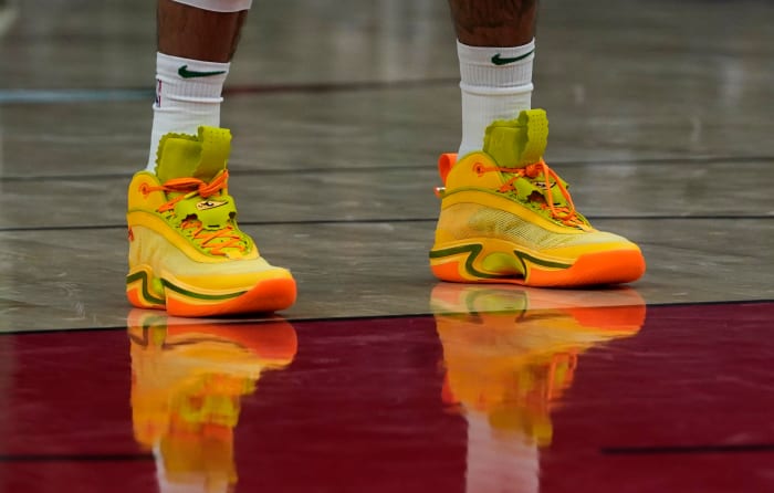 Green, yellow, and orange Air Jordan shoes.